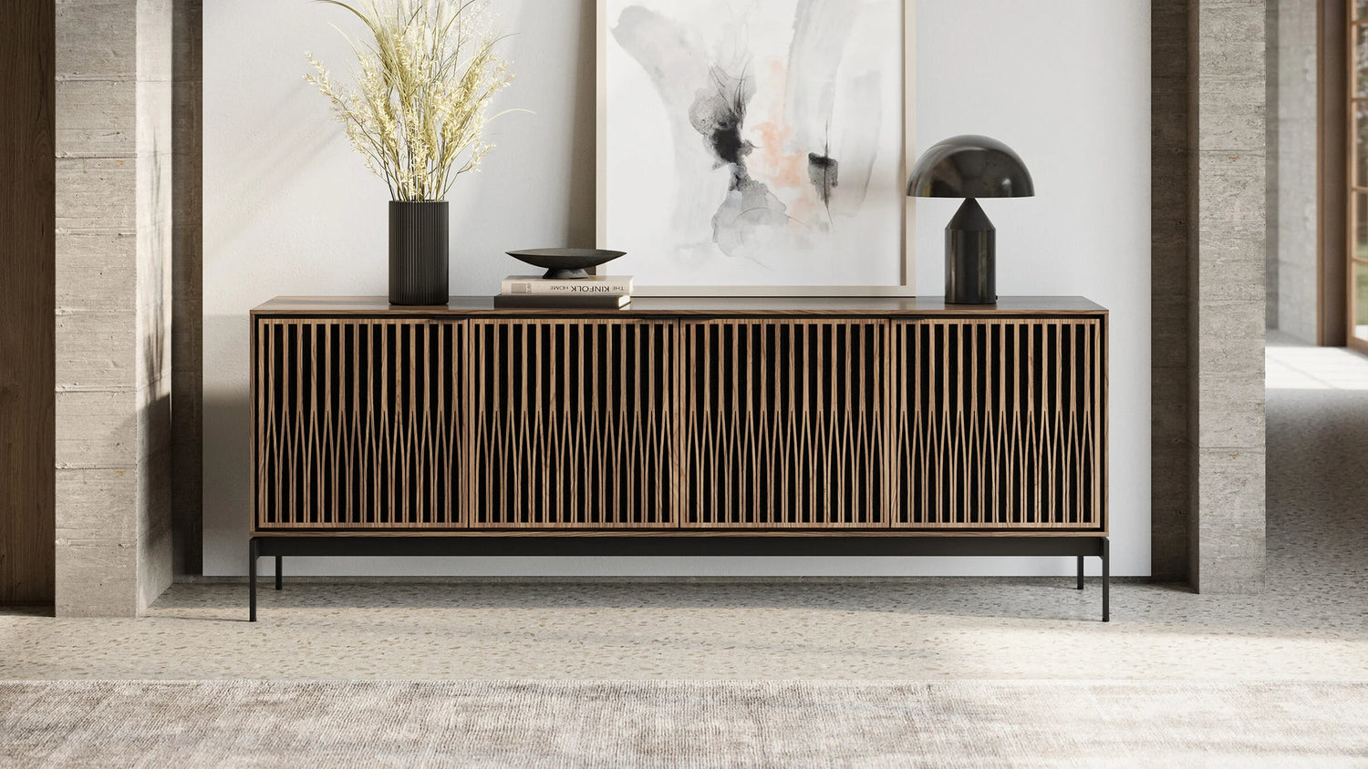 BDI Elements 8709 Tune contemporary wood media cabinet featuring acoustically transparent slatted doors and black metal legs, styled with a modern black lamp and abstract wall art.