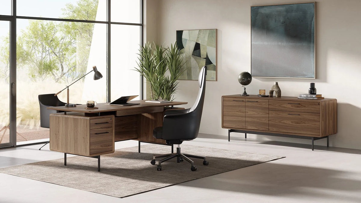 BDI Linq executive modern wood desk with matching credenza and high-back office chair in a brightly lit modern office setting
