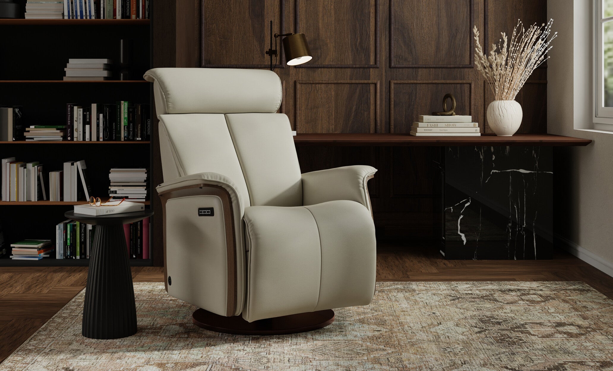 Fjords Jewel modern beige leather power recliner chair with wood accents, styled in an elegant home office setting with dark wood paneling, a bookshelf, and a patterned area rug.
